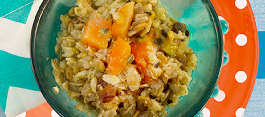 Oatmeal topped with passionfruit and papaya